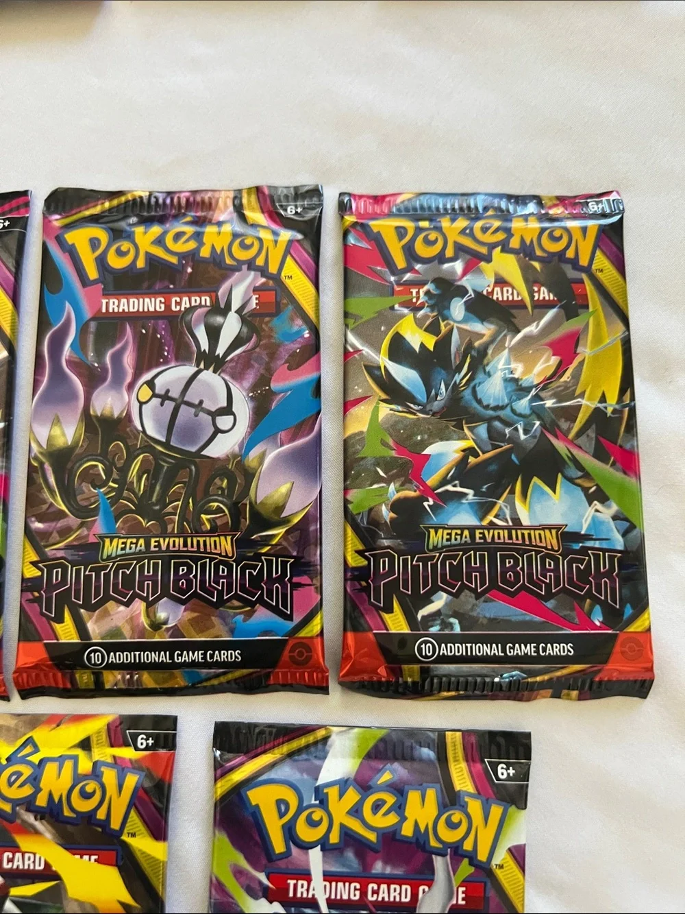 Pokemon Pitch Black Booster Packs - Yellow, Black, Purple, Red